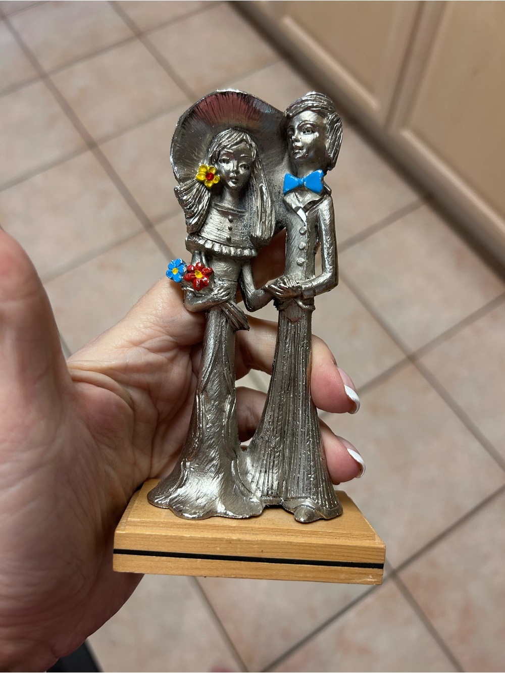 Silver-Tone Romantic Couple Sculpture with Blue and Red Floral Accents
